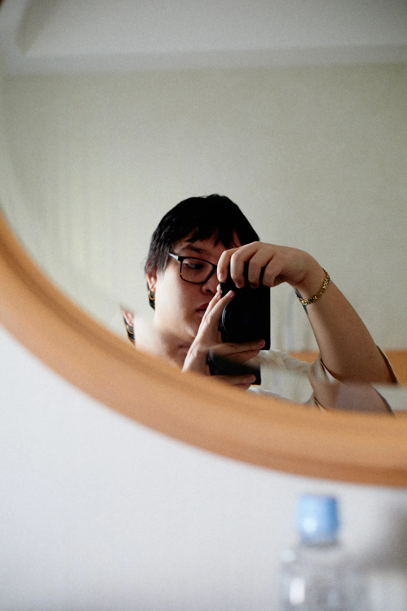 Marceline Belardo taking a mirror photograph with a camera